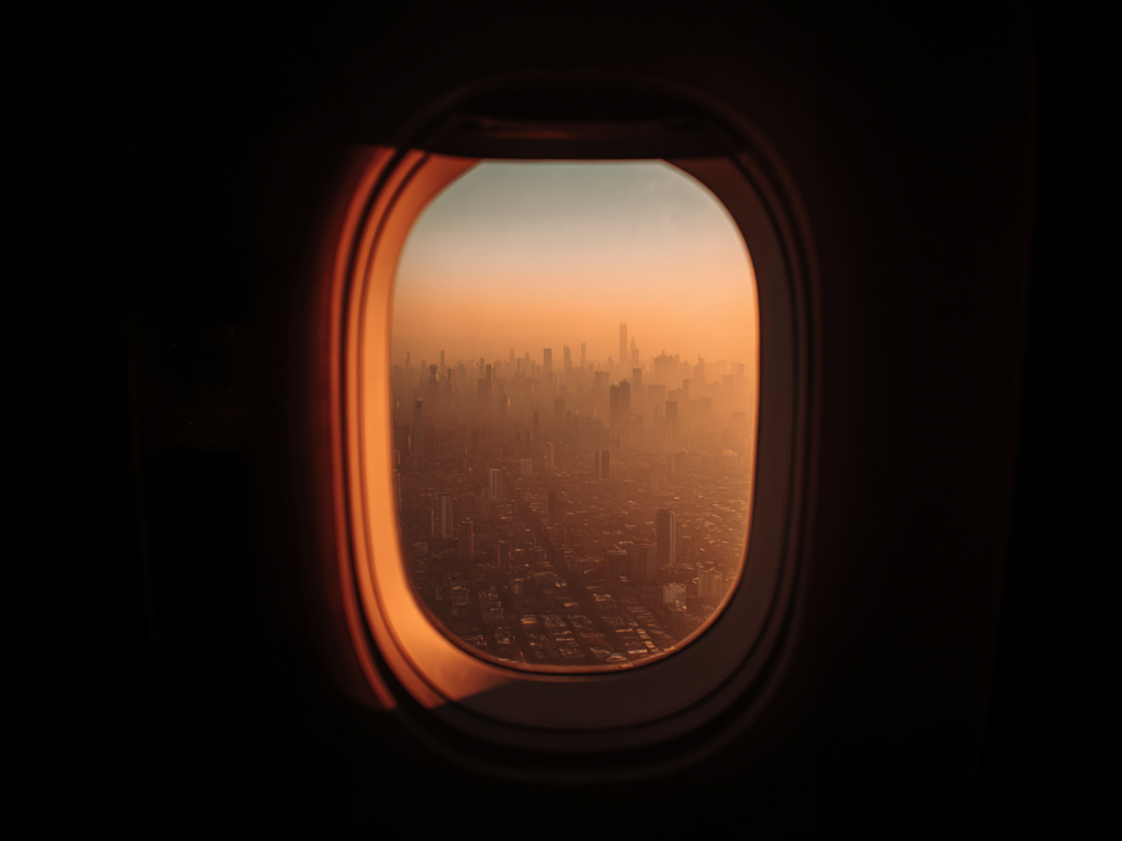 View through an aircraft window at dusk